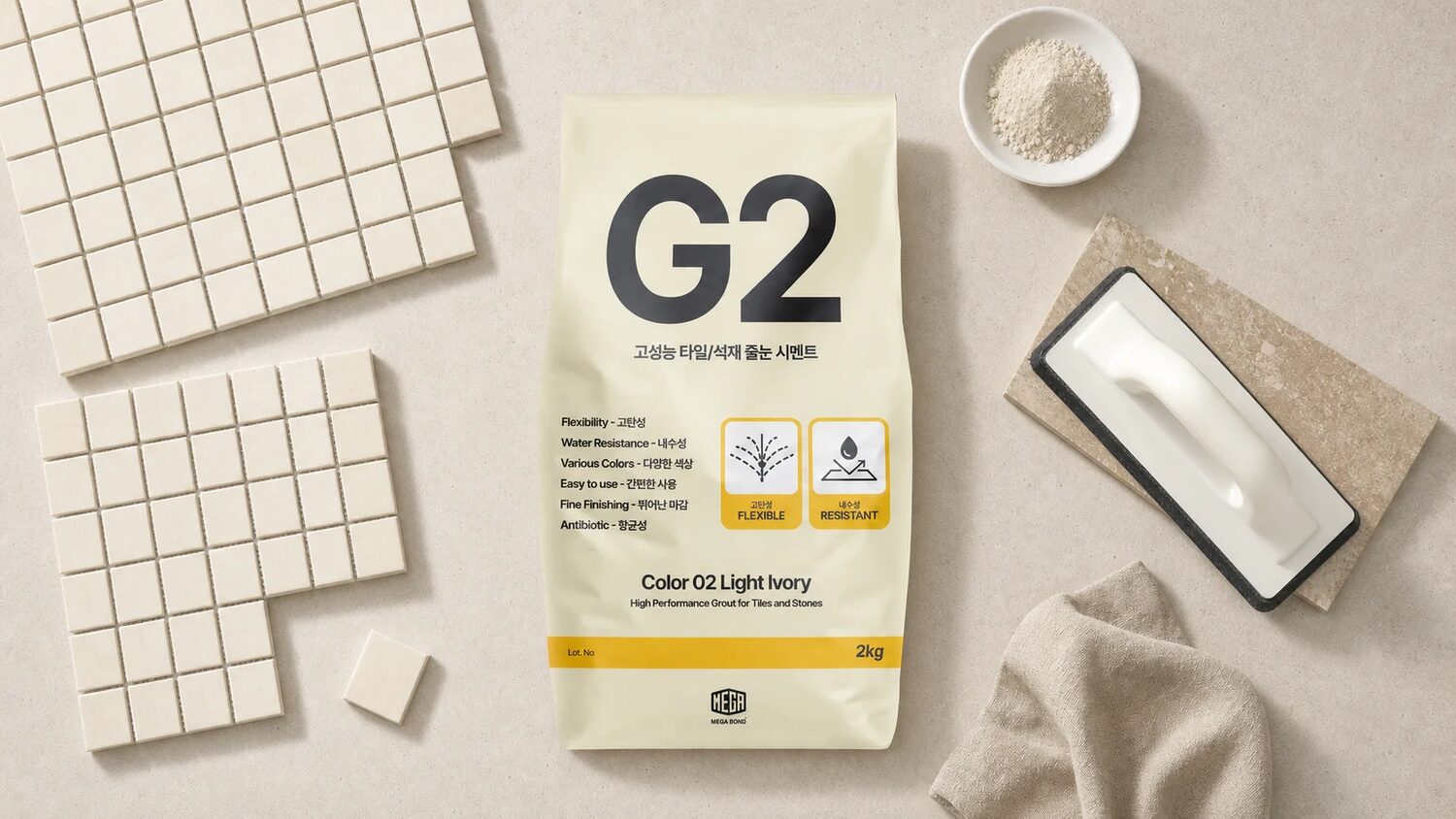 셀프타일시공 모자이크 타일 위에 놓인 G2 줄눈시멘트와 고무 흙손